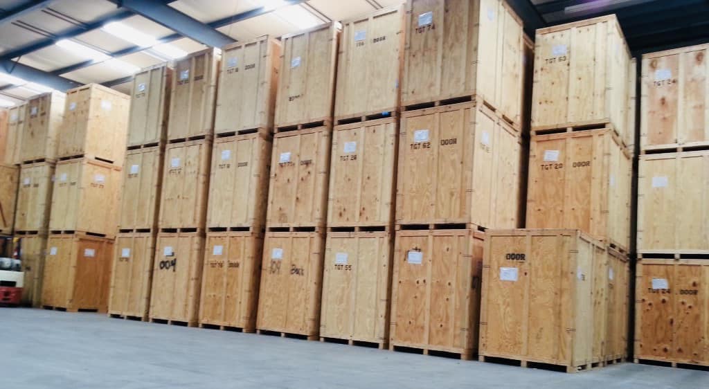 A warehouse filled with lots of wooden boxes.