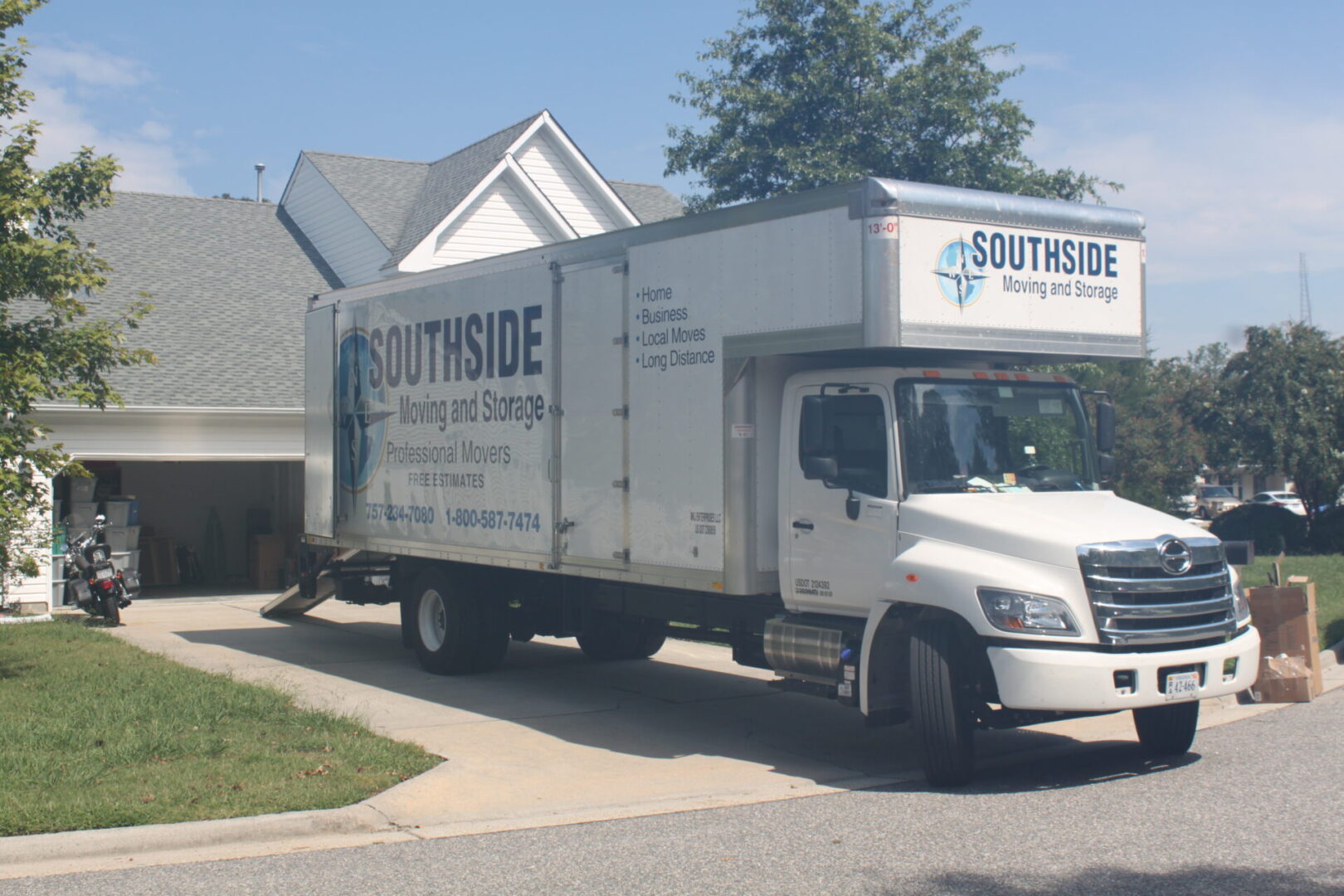 A white truck parked in front of a house.