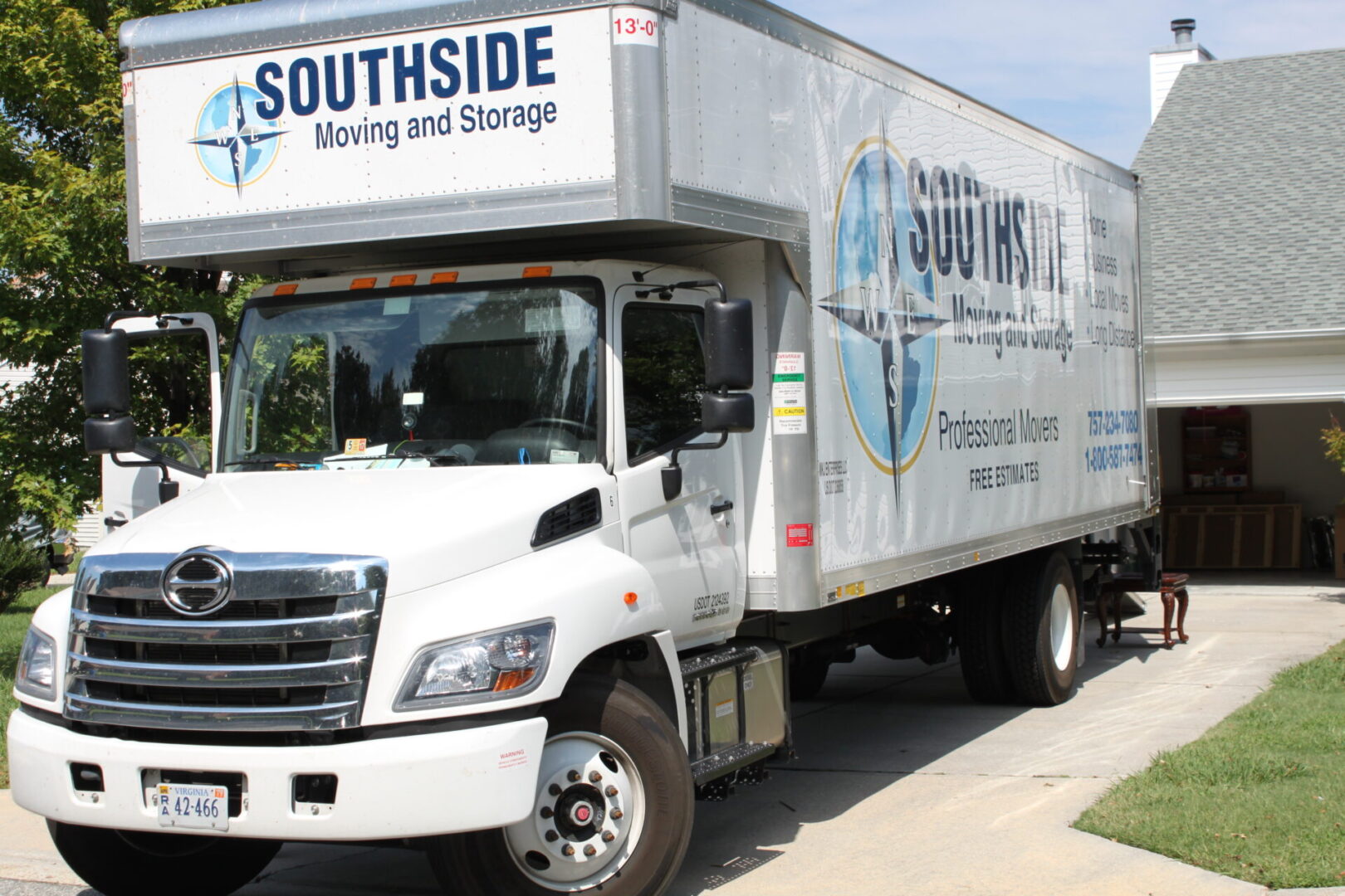 A white truck with the words " southside moving and storage ".