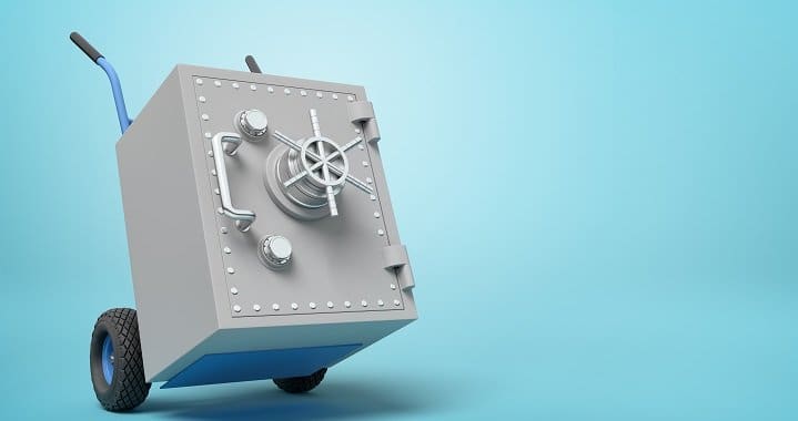 3d rendering of big light-grey metal safe on blue hand truck on light-blue background with copy space. Saving money. Money deposits. Bank security system.